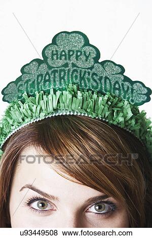 Stock Photo - USA California, Fairfax, close-up of young woman wearing green diadem for St. Patrick's Day. Fotosearch
