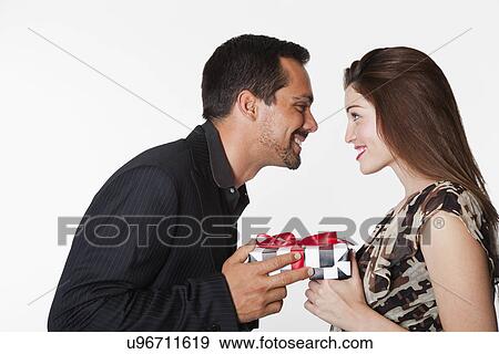 USA, California, Fairfax, Couple holding gift View Large Photo Image Stock Photo - USA, California, Fairfax, Couple holding gift. Fotosearch