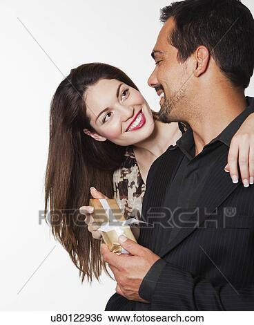 USA, California, Fairfax, Couple holding gift View Large Photo Image Stock Photograph - USA, California, Fairfax, Couple holding gift. Fotosearch