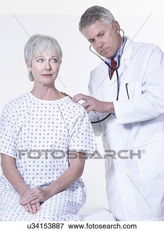 USA, California, Fairfax, Doctor examining female patient View Large Photo Image Stock Photo - USA, California, Fairfax, Doctor examining female patient. Fotosearch