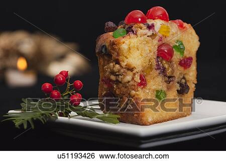Stock Photograph - USA California, Fairfax, fruitcake and Christmas decoration. Fotosearch
