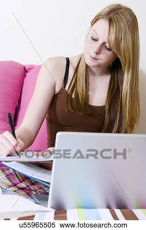 USA, California, Fairfax, girl (14-15) doing homework on bed View Large Photo Image Stock Photography - USA, California, Fairfax, girl (14-15) doing homework on bed. Fotosearch