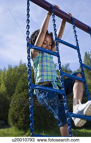 USA California, Fairfax, girl (6-7) climbing ladder in playground View Large Photo Image Stock Image - USA California, Fairfax, girl (6-7) climbing ladder in playground. Fotosearch