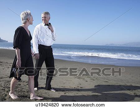 USA, California, Fairfax, Happy mature couple walking on beach View Large Photo Image Stock Image - USA, California, Fairfax, Happy mature couple walking on beach. Fotosearch