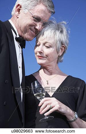 USA, California, Fairfax, Happy mature couple drinking wine on beach View Large Photo Image Stock Image - USA, California, Fairfax, Happy mature couple drinking wine on beach. Fotosearch