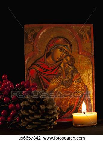 Stock Image - USA California, Fairfax, icon with Virgin Mary and Jesus, candle and pine cone. Fotosearch