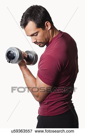 USA, California, Fairfax, Man exercising using dumbbell View Large Photo Image Stock Photo - USA, California, Fairfax, Man exercising using dumbbell. Fotosearch