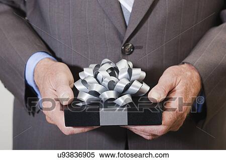 USA California, Fairfax, man's hands holding gift View Large Photo Image Stock Photography - USA California, Fairfax, man's hands holding gift. Fotosearch