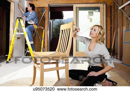 USA, California, Fairfax, Mid adult couple doing home improvement work together View Large Photo Image Stock Image - USA, California, Fairfax, Mid adult couple doing home improvement work together. Fotosearch