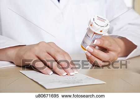 USA, California, Fairfax, Midsection of doctor holding pill bottle View Large Photo Image Stock Photography - USA, California, Fairfax, Midsection of doctor holding pill bottle. Fotosearch