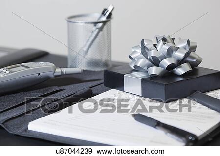 USA California, Fairfax, office supplies and gift on desk View Large Photo Image Stock Photo - USA California, Fairfax, office supplies and gift on desk. Fotosearch