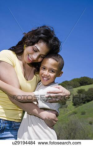 USA California, Fairfax, portrait of mother hugging son (8-9) outdoors View Large Photo Image Picture - USA California, Fairfax, portrait of mother hugging son (8-9) outdoors. Fotosearch