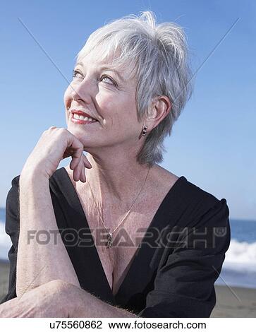 USA, California, Fairfax, Portrait of smiling woman on beach View Large Photo Image Stock Image - USA, California, Fairfax, Portrait of smiling woman on beach. Fotosearch