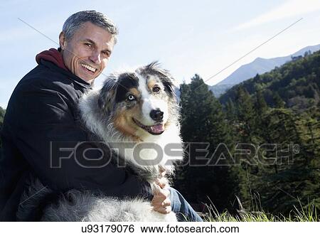 USA, California, Fairfax, Portrait of mature man with dog View Large Photo Image Stock Photograph - USA, California, Fairfax, Portrait of mature man with dog. Fotosearch
