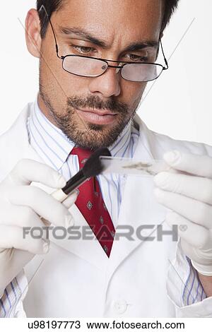 USA, California, Fairfax, Scientist examining sample View Large Photo Image Stock Image - USA, California, Fairfax, Scientist examining sample. Fotosearch