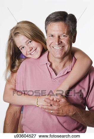 Stock Photo - USA, California, Fairfax, Studio portrait of father and daughter (10-11). Fotosearch