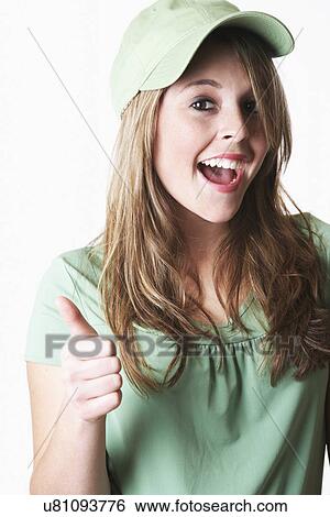USA California, Fairfax, studio portrait of smiling young woman gesturing View Large Photo Image Stock Photograph - USA California, Fairfax, studio portrait of smiling young woman gesturing. Fotosearch