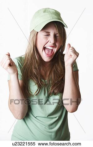 Stock Photography - USA California, Fairfax, studio portrait of enthusiastic young woman. Fotosearch