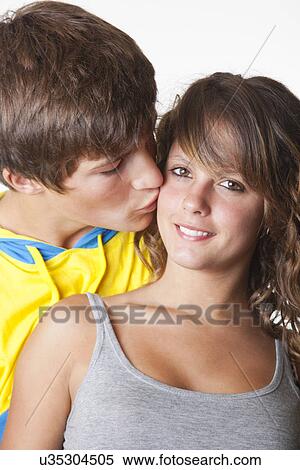 USA, California, Fairfax, Teen boy kissing girlfriend (14-17) View Large Photo Image Stock Photography - USA, California, Fairfax, Teen boy kissing girlfriend (14-17). Fotosearch