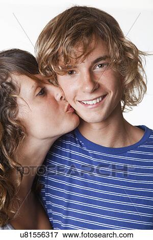 USA, California, Fairfax, Teen girl kissing boyfriend (14-15) View Large Photo Image Stock Photo - USA, California, Fairfax, Teen girl kissing boyfriend (14-15). Fotosearch