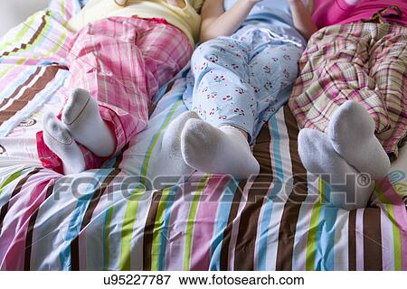 USA California, Fairfax, teenage girls (14-15, 16-17) lying on bed, low section View Large Photo Image Stock Photo - USA California, Fairfax, teenage girls (14-15, 16-17) lying on bed, low section. Fotosearch