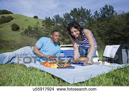 USA California, Fairfax, young couple having picnic in hilly landscape View Large Photo Image Picture - USA California, Fairfax, young couple having picnic in hilly landscape. Fotosearch