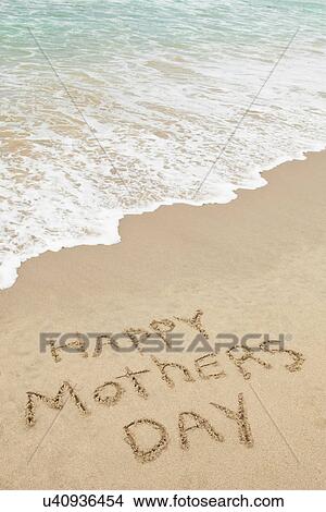 Picture - USA, California, Hermosa Beach, Happy mothers day written in sand on beach. Fotosearch