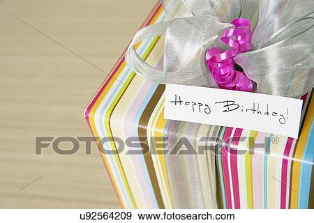 USA, California, La Quinta, Birthday gift with greeting card View Large Photo Image Stock Photo - USA, California, La Quinta, Birthday gift with greeting card. Fotosearch