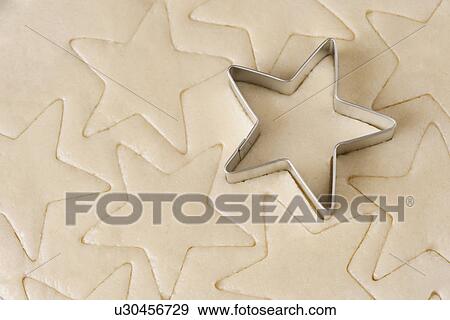 USA, California, La Quinta, Dough with starcookie cutter View Large Photo Image Stock Photo - USA, California, La Quinta, Dough with starcookie cutter. Fotosearch