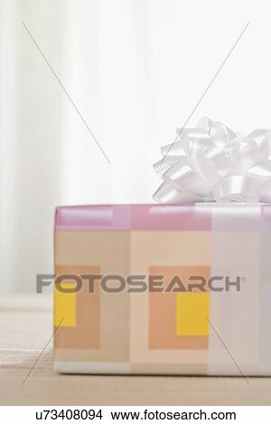 USA, California, La Quinta, Gift wrapped in pastel colored paper View Large Photo Image Picture - USA, California, La Quinta, Gift wrapped in pastel colored paper. Fotosearch