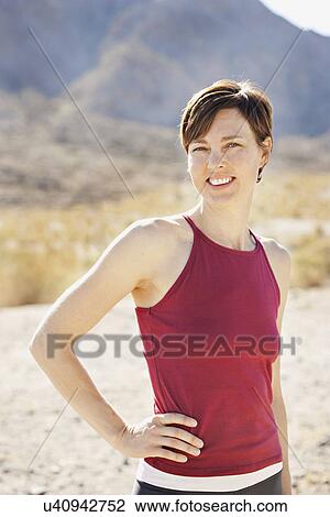 USA, California, La Quinta, Portrait of woman in desert landscape View Large Photo Image Stock Image - USA, California, La Quinta, Portrait of woman in desert landscape. Fotosearch