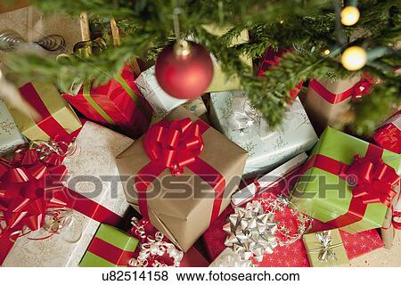 Stock Photo - USA, California, La Quinta, Presents under Christmas tree. Fotosearch