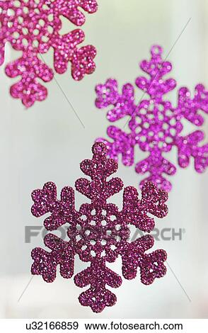 Stock Photo - USA, California, La Quinta, Shiny snowflakes against white background. Fotosearch