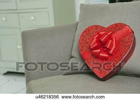 USA, California, La Quinta, Star shape chocolate box on sofa View Large Photo Image Stock Photograph - USA, California, La Quinta, Star shape chocolate box on sofa. Fotosearch