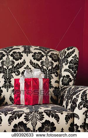 USA, California, La Quinta, Transparent Christmas present on sofa View Large Photo Image Stock Image - USA, California, La Quinta, Transparent Christmas present on sofa. Fotosearch