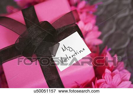 Stock Photo - USA, California, La Quinta, Valentine's Day gift with greeting card. Fotosearch