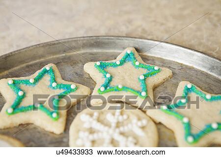 Stock Image - USA, California, Lawndale, Christmas cookies on tray. Fotosearch