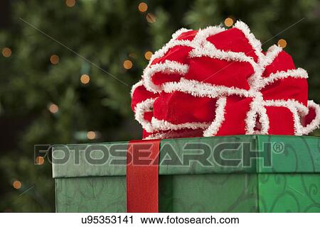 USA, California, Lawndale, Christmas gift with red ribbon View Large Photo Image Stock Image - USA, California, Lawndale, Christmas gift with red ribbon. Fotosearch
