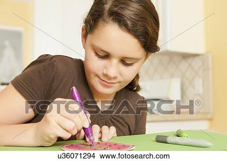 USA, California, Lawndale, Girl (10-11) preparing holiday decoration View Large Photo Image Picture - USA, California, Lawndale, Girl (10-11) preparing holiday decoration. Fotosearch