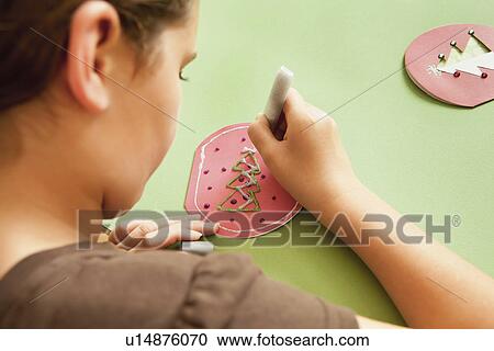 USA, California, Lawndale, Girl (10-11) preparing holiday decoration View Large Photo Image Stock Image - USA, California, Lawndale, Girl (10-11) preparing holiday decoration. Fotosearch