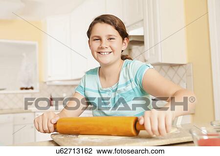 USA, California, Lawndale, Girl (10-11) rolling dough View Large Photo Image Stock Image - USA, California, Lawndale, Girl (10-11) rolling dough. Fotosearch