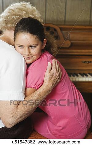 USA, California, Lawndale, Grandmother embracing granddaughter (8-9) View Large Photo Image Stock Image - USA, California, Lawndale, Grandmother embracing granddaughter (8-9). Fotosearch