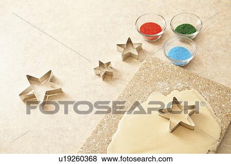 Stock Photo - USA, California, Lawndale, Pastry cutter on dough. Fotosearch