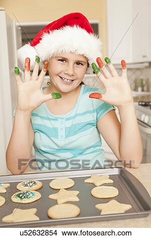 USA, California, Lawndale, Portrait of girl (10-11) with colorful fingers baking cookies View Large Photo Image Picture - USA, California, Lawndale, Portrait of girl (10-11) with colorful fingers baking cookies. Fotosearch