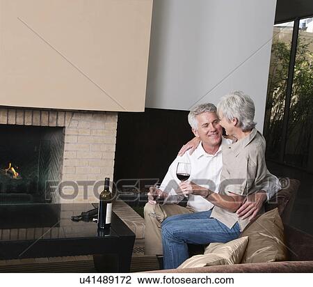 USA, California, Mill Valley, Couple drinking wine in living room View Large Photo Image Stock Image - USA, California, Mill Valley, Couple drinking wine in living room. Fotosearch
