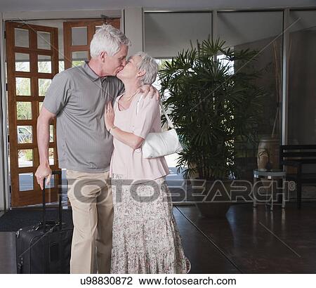 USA, California, Mill Valley, Couple kissing in hotel lobby View Large Photo Image Stock Image - USA, California, Mill Valley, Couple kissing in hotel lobby. Fotosearch