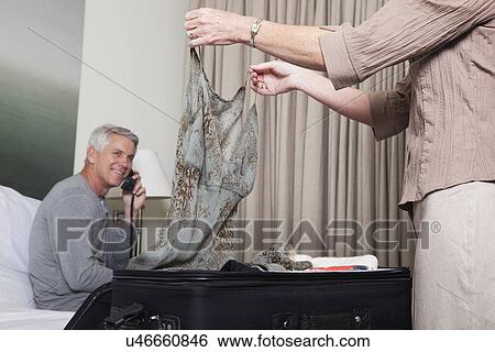 USA, California, Mill Valley, Couple unpacking in hotel room View Large Photo Image Stock Photograph - USA, California, Mill Valley, Couple unpacking in hotel room. Fotosearch