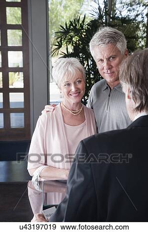 Stock Photo - USA, California, Mill Valley, Hotel guests checking in. Fotosearch