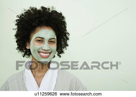 USA, California, Oakland, portrait of smiling young woman with facial mask View Large Photo Image Stock Photograph - USA, California, Oakland, portrait of smiling young woman with facial mask. Fotosearch