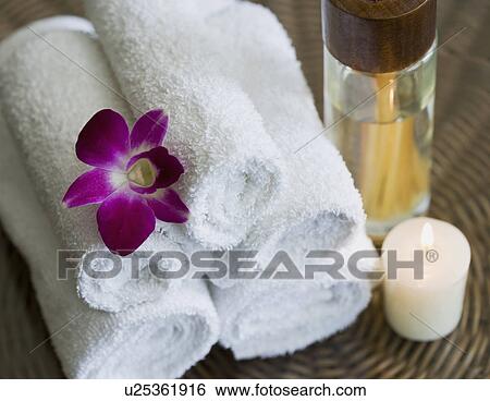 USA, California, Oakland, rolled up towels, aroma sticks, candle and orchid on table View Large Photo Image Stock Photograph - USA, California, Oakland, rolled up towels, aroma sticks, candle and orchid on table. Fotosearch